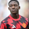 Kobbie Mainoo sous le maillot de Manchester United, déterminé à trouver plus de temps de jeu cet hiver.